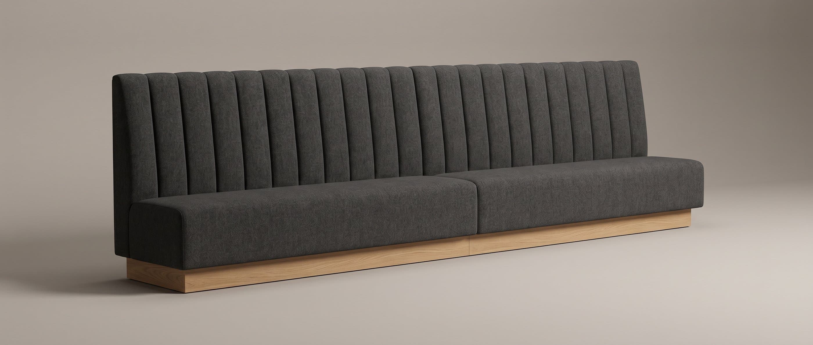 A long charcoal fluted PIER banquette on an oak kick plinth, made as two equal sections